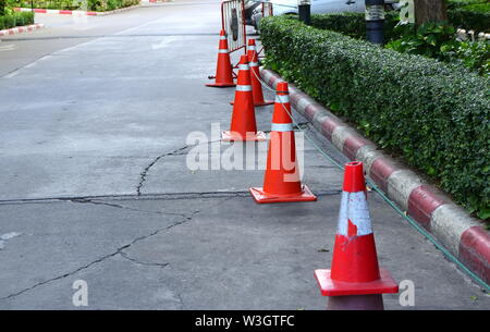 Closeup of group of traffic cones on street, selective focus, safety concept Stock Photo