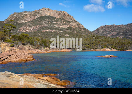 Honeymoon Bay Tasmania, blue sky winters day at Honeymoon Bay in Freycinet national park,Australia Stock Photo