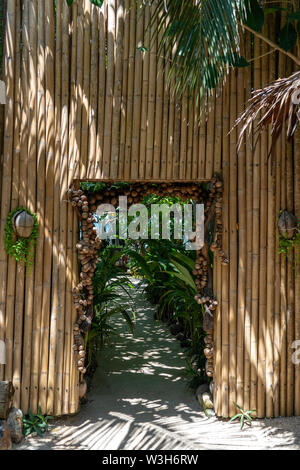 Entrance to the beach in the fence of bamboo sticks, Thailand. Holiday and summer concept Stock Photo