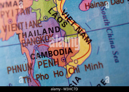 Foucus to the travel destination of Cambodia on a colorful world globe in a political, educational or tourism concept Stock Photo