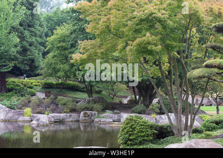 hamburg japanese garden lake with reflections and stones Stock Photo