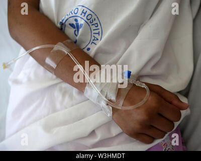 Manila, Philippines. 16th July, 2019. A patient rests inside a dengue ward of the San Lazaro Hospital in Manila, the Philippines, July 16, 2019. The Philippines declared a 'national dengue alert' on Monday in several regions of the Philippines due to 'the rapidly increasing number of cases.' From January 1 to June 29, 2019, the Philippine Department of Health (DOH) said 106,630 dengue cases have been reported nationwide, an 85 percent increase from the 57,564 cases reported over the same period last year, and at least 450 deaths were recorded. Credit: Rouelle Umali/Xinhua/Alamy Live News Stock Photo