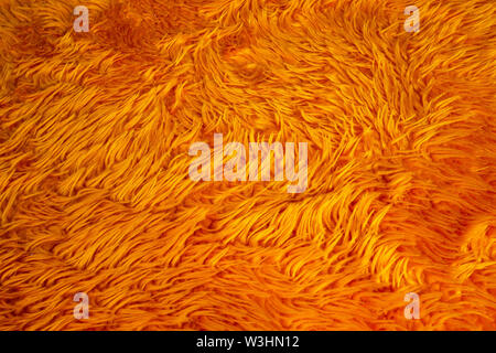 orange fur background texture, nature wool fluffy colorful Stock Photo