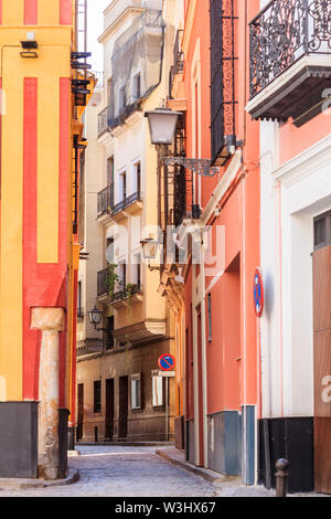 Typical narrow street in old Seville, Spain Stock Photo