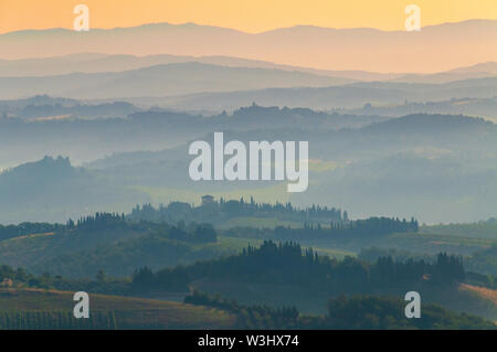 Hills of Tuscany at dawn at San Gimignano, Italy Stock Photo