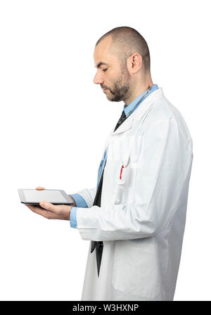 portrait of a doctor using a tablet for diagnosis, side view isolated on white background. Stock Photo