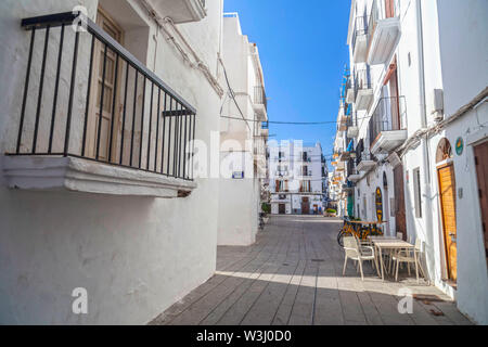 IBIZA,SPAIN-OCTOBER 10,2019: White houses close to port in La Marina quarter of Ibiza, Eivissa, Balearic Islands. Spain. Stock Photo