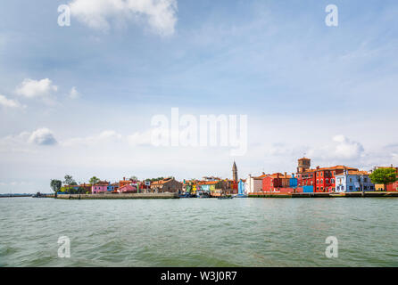 View of Burano, a picturesque small island in Venice Lagoon, Venice, Italy with the leaning campanile of the Church of San Martino on the skyline