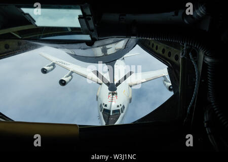 An E-3 Sentry from the 961st Airborne Air Control Squadron  refuels with a KC-135 Stratotanker from the 909th Air Refueling Squadron July 10, 2019, during a training exercise out of Kadena Air Base, Japan. The Sentry provides all-weather surveillance, command, control, and communications in support of a free-and-open Indo-Pacific. (U.S. Air Force photo by Airman 1st Class Matthew Seefeldt) Stock Photo
