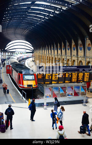 passengers boarding LNER class 43 (HST) train by digital train information boards at york station yorkshire united kingdom Stock Photo