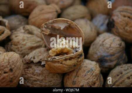 Cracked walnut in others Stock Photo