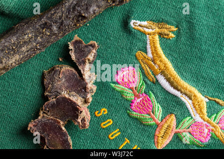 QUEENSTOWN, SOUTH AFRICA - 16 JULY 2019 -South African Springbok rugby jersey circa 1995 World Cup with slices of venison biltong, typical South Afric Stock Photo