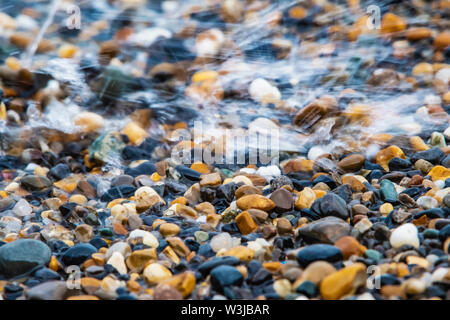 Abstract background with decorative floor pattern of sea gravel stones, Gravel texture with selective focus. Stock Photo