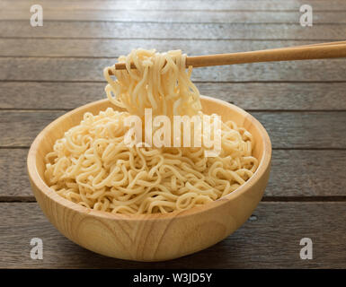 Instant noodles to clamp with chopsticks. Stock Photo