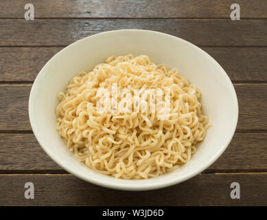 Instant noodles in bowls on wood table Stock Photo