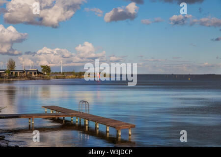 Jetty with a beautiful view of the Markermeer at dusk in the Netherlands Stock Photo