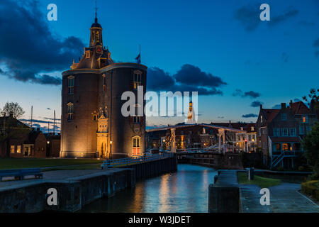 Historic Drommedaris Gate - city gate of Enkhuizen in the Netherlands, at blue hour - dusk Stock Photo