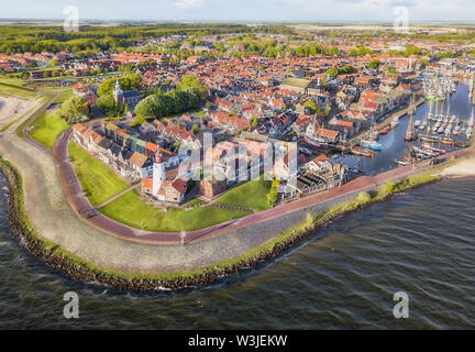 Aerial view of Urk with its lighthouse, a small coastal village on the IJsselmeer in the Netherlands. Stock Photo
