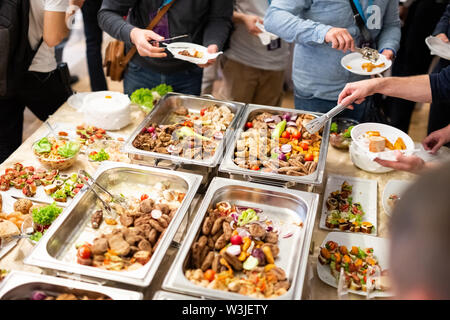Hand of people take buffet food in hotel party, Food and drink Stock Photo