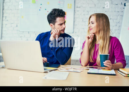 web developers duscussing start-up design in office Stock Photo