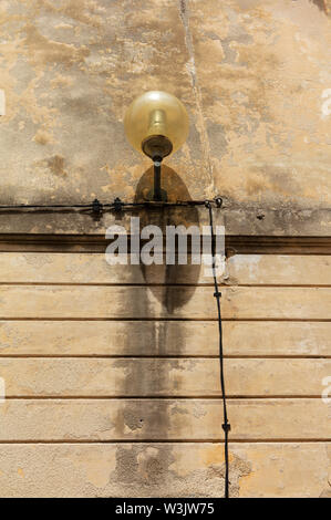 Street lamp mounted on wall,Porec,Istria,Croatia