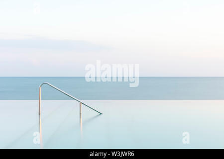 Infinity pool and rail with the sea, Novigrad, Istria, Croatia Stock Photo