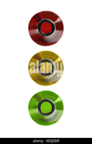 Drunk driving concept. Traffic offense. Drink alcohol behind the wheel. Traffic light from bottles, isolated. Red, yellow and green bottles. Stock Photo