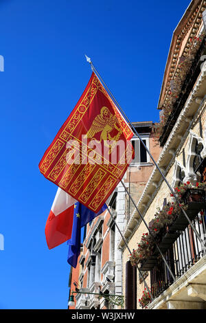 Flag of Venice in venetian building. Stock Photo