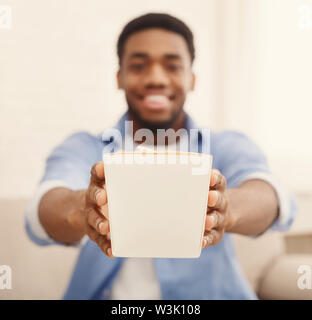 Man enjoying chinese fast food in delivery box Stock Photo