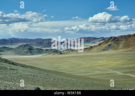 Mongolian Altai.  Scenic valley on the background of the snowcapped mountains. Stock Photo