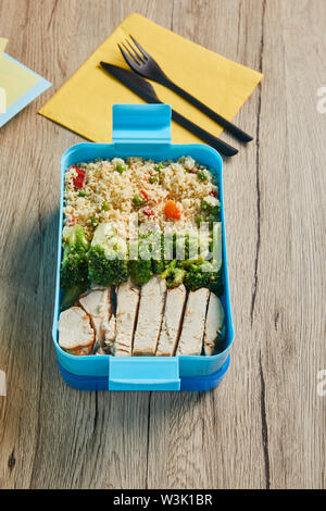 Plastic lunch box on wooden background Stock Photo - Alamy