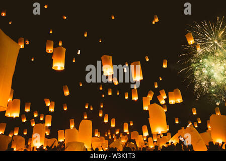 Loy krathong festival, thai new year party with floating lanterns release in the night sky Stock Photo