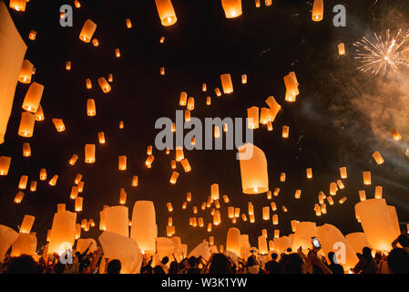 Loy krathong festival, thai new year party with floating lanterns release in the night sky Stock Photo