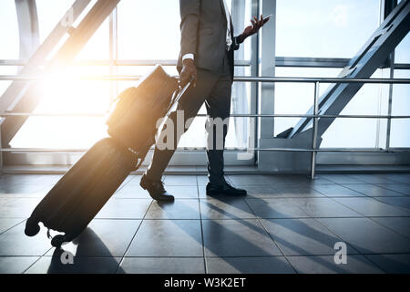 Businessman Carrying Baggage, Moving to Boarding Gate