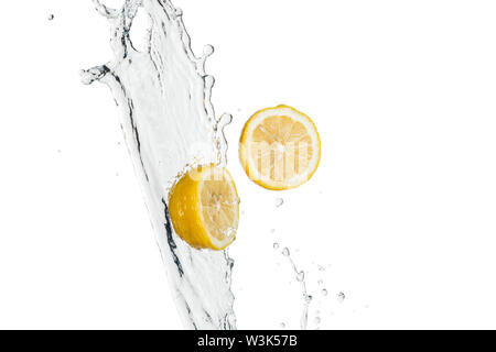 yellow fresh lemons with water splash and drops isolated on white Stock Photo