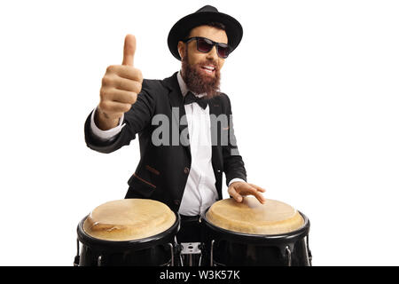 Male artist with conga drums showing thumbs up isolated on white background Stock Photo