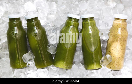 Set of Different detox cocktails in glass jar on ice cubes Stock Photo