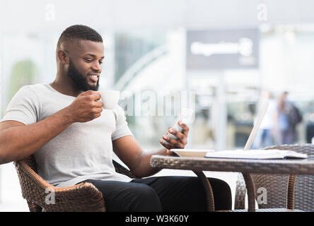 African american guy having free time to drink coffe Stock Photo