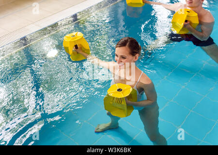 Young woman in aquarobics class Stock Photo