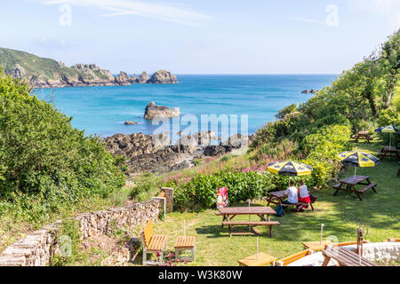 The beautiful rugged south coast of Guernsey - A view of Moulin Huet Bay from the tea gardens, Guernsey, Channel Islands UK Stock Photo