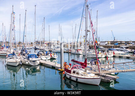 Moored yachts in the harbour at St Peter Port, Guernsey, Channel Islands UK Stock Photo