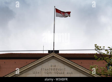 Potsdam, Germany. 15th July, 2019. Brandenburg flag above the entrance of the State Chancellery in Heinrich-Mann-Allee. Credit: Soeren Stache/dpa/Alamy Live News Stock Photo