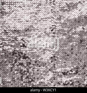 Shiny background made of silver sequins. Luxury scaly Background. Stock Photo