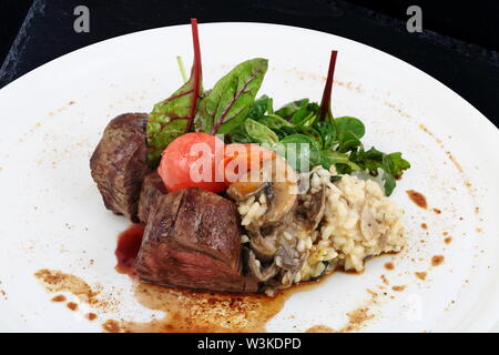 Mushroom soup puree on a black background Stock Photo