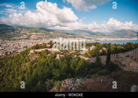 Alanya city in warm sunset tones with road down, Turkey, Antalya district Stock Photo