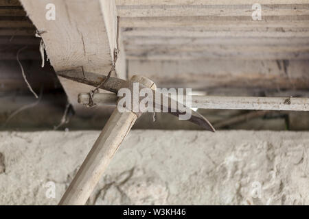 old iron pickaxe hanging on top Stock Photo
