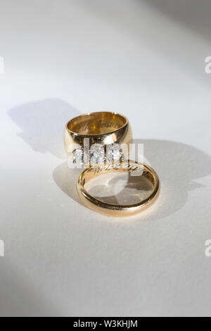 Still Life of two wedding bands on white background Stock Photo