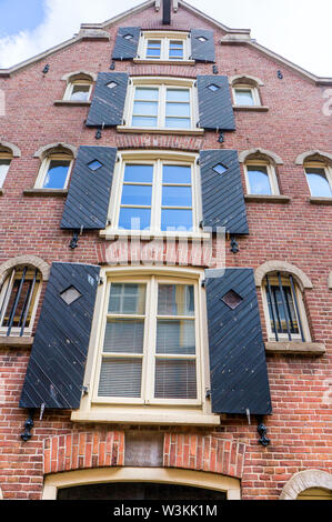 Typical facade of an old brick Dutch house. Stock Photo