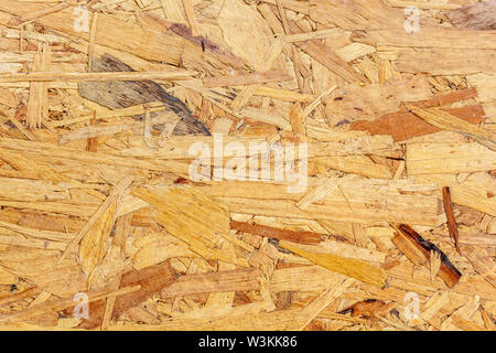 Texture of Pressed Wooden Panel. OSB (Oriented Strand Board) Stock Photo