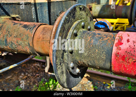 The rusty buffers of two old railway cars collide Stock Photo